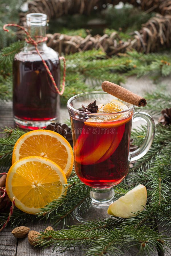 Christmas Hot Mulled Wine with Cinnamon, Orange and Christmas Tree on ...