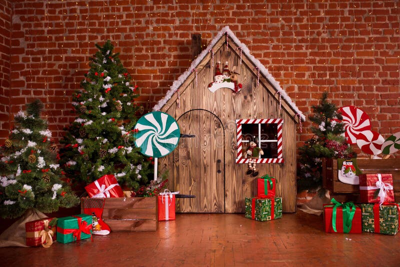 Christmas interior with wooden house, candy, tree and gifts. No people. Holiday background stock images