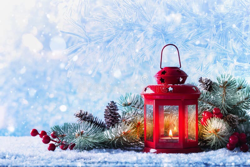 Christmas Lantern in Snow with Fir Tree Branch. Winter Cozy Scene Stock