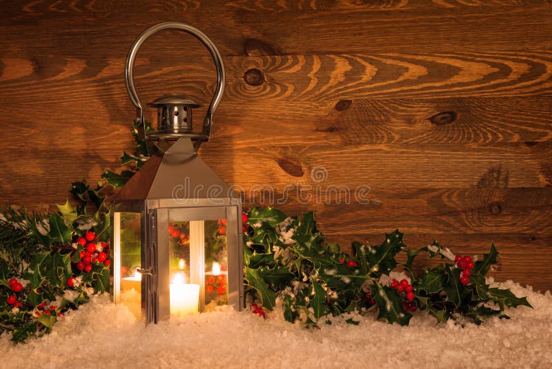 Christmas Lantern in Snow and Holly Stock Image - Image of candle ...