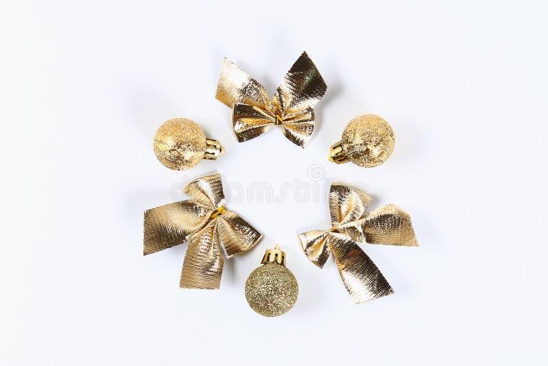 Christmas layout. Golden toy ball, bow on a white background. New Year 2019, christmas, winter concept. Copy space, tov view, flat