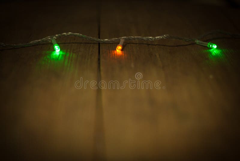 ,Christmas lights, light glitter vintage on wood background,bokeh background,defocused .Happy Birthday,Valentine day. stock image ,Christmas lights, light glitter vintage on wood background,bokeh background,defocused .Happy Birthday,Valentine day. stock image