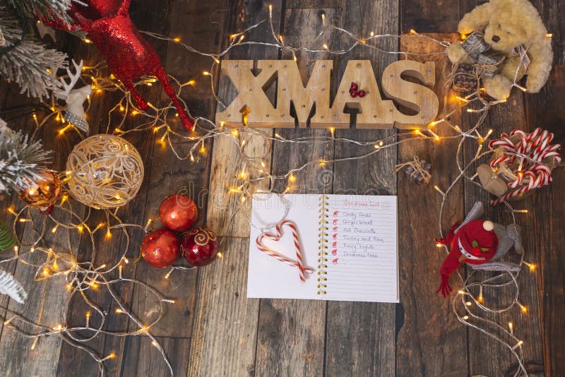 Christmas List on Rustic Wood with Christmas Decorations Stock Image