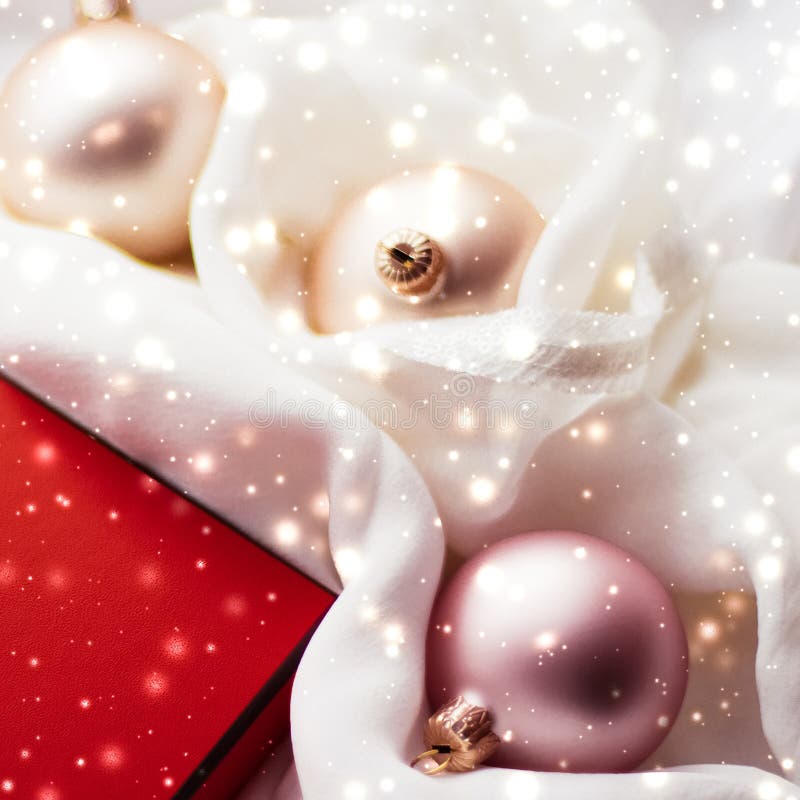 Christmas magic holiday background, festive baubles, red vintage gift box and golden glitter as winter season present for luxury stock images Christmas magic holiday background, festive baubles, red vintage gift box and golden glitter as winter season present for luxury stock images