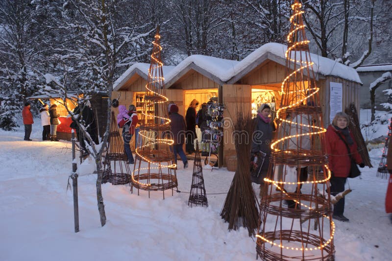 ETTAL, BAVARIA, GERMANY - DECEMBER 4: The traditional annual christmas market with illuminated shops at night in famous 700 years old benedictine abbey Ettal, nearby city Oberammergau and Garmisch, December 4, 2010 in Ettal, Germany