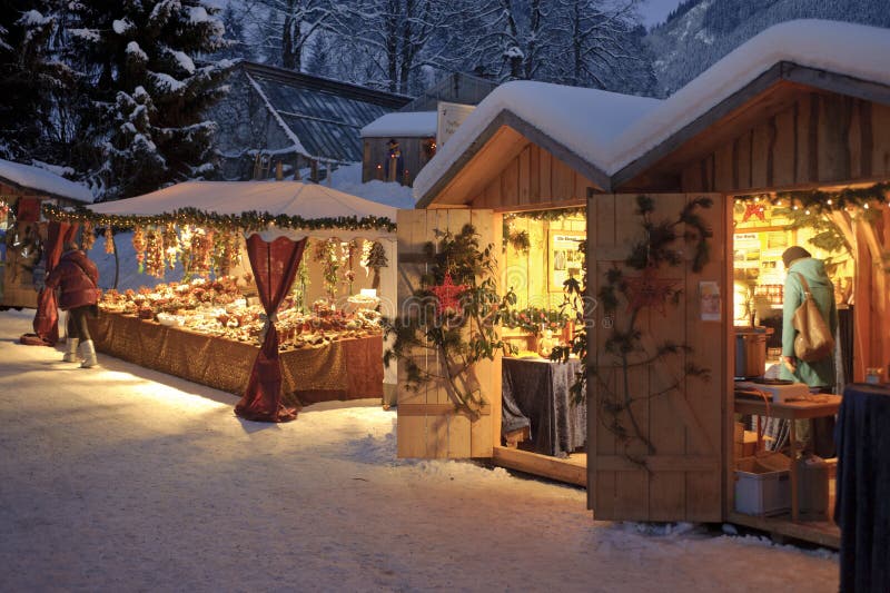 ETTAL, BAVARIA, GERMANY - DECEMBER 4: The traditional annual christmas market with illuminated shops at night in famous 700 years old benedictine abbey Ettal, nearby city Oberammergau and Garmisch, December 4, 2010 in Ettal, Germany