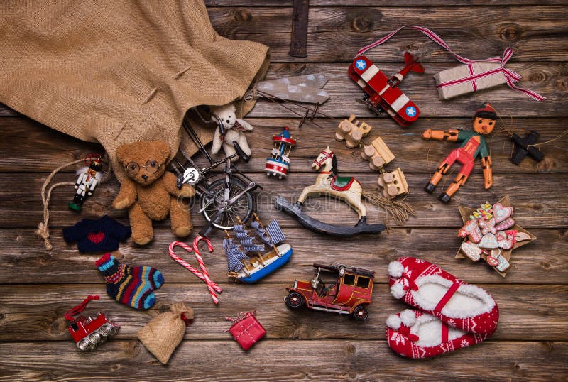 Christmas memories in childhood: old and tin toys on wooden back
