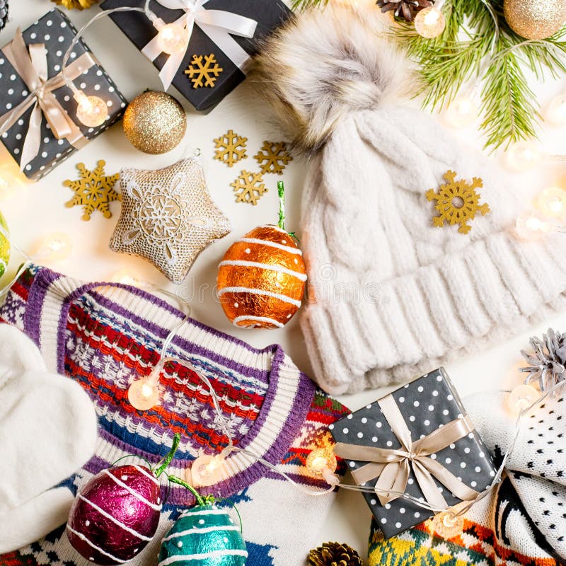 Christmas mood composition with Christmas sweater, hat, presents and lights. Winter concept flat lay, top view royalty free stock photos Christmas mood composition with Christmas sweater, hat, presents and lights. Winter concept flat lay, top view royalty free stock photos