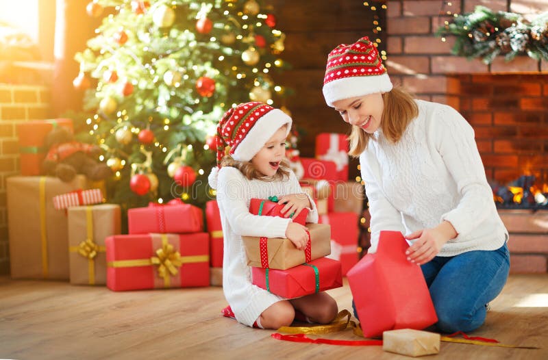 Christmas morning. family mother and daughter unpack, open gift