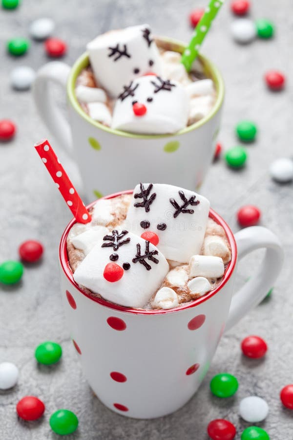 Christmas mugs hot chocolate with melted marshmallow reindeers royalty free stock photography