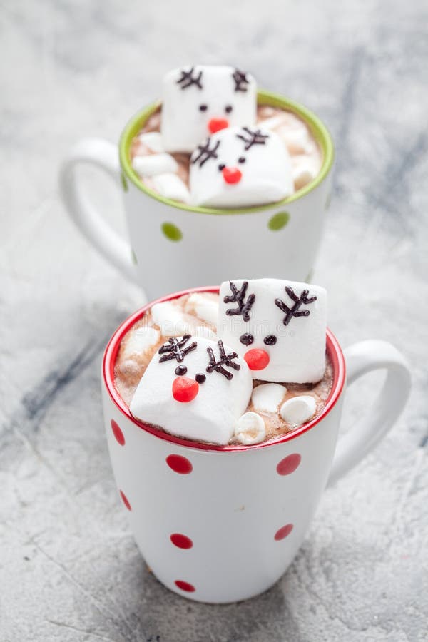 Christmas mugs hot chocolate with melted marshmallow reindeers royalty free stock image