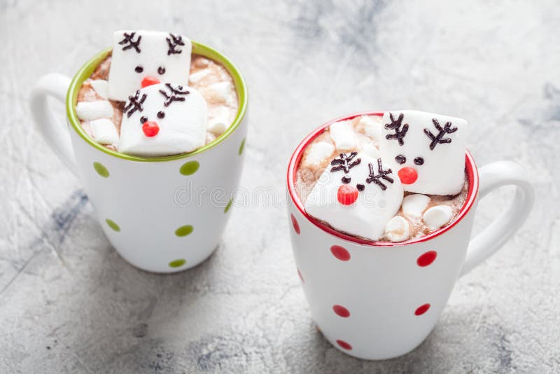 Christmas mugs hot chocolate with melted marshmallow reindeers royalty free stock photo