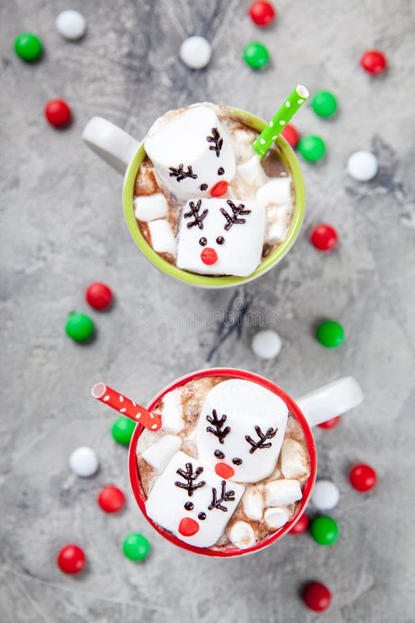 Christmas mugs hot chocolate with melted marshmallow reindeers stock images