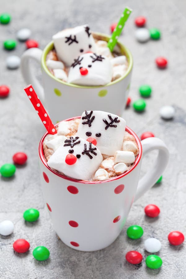 Christmas mugs hot chocolate with melted marshmallow reindeers royalty free stock photography