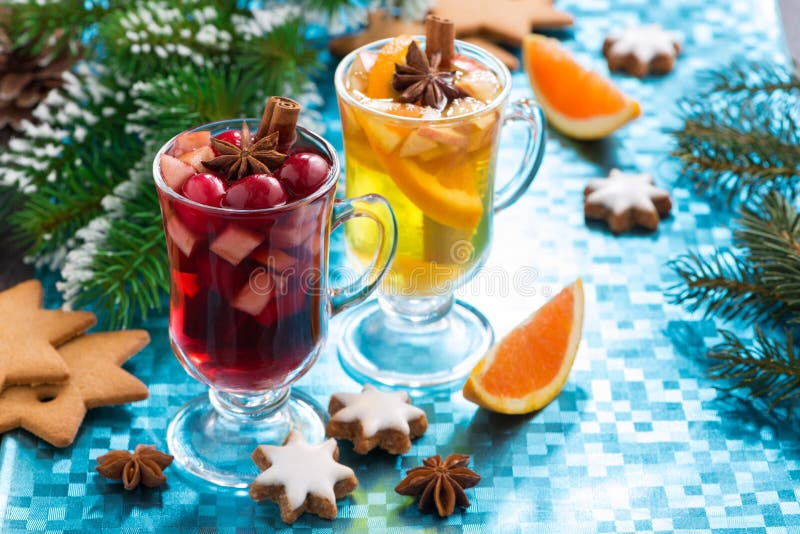 Christmas mulled wine and spiced apple cider on blue background