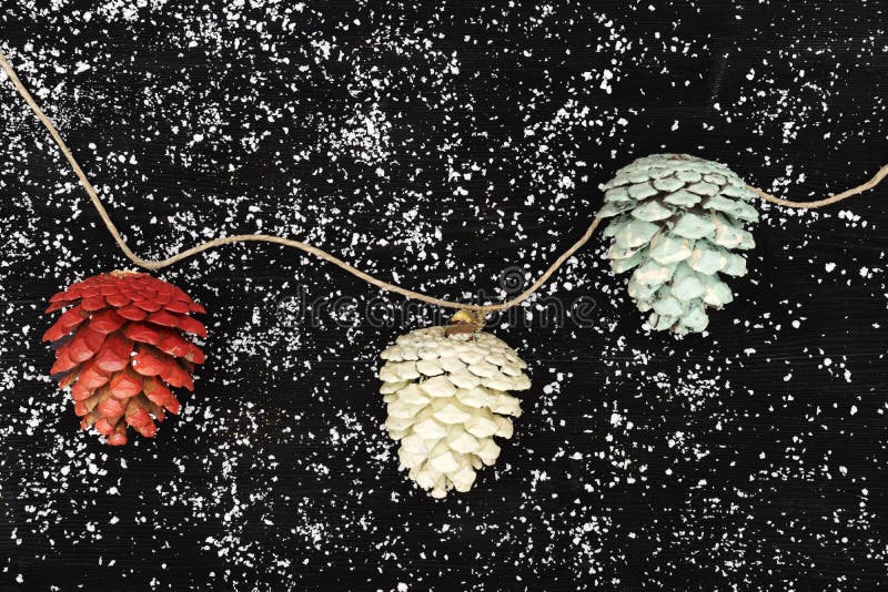 Christmas natural decoration with pinecones painted with different colors