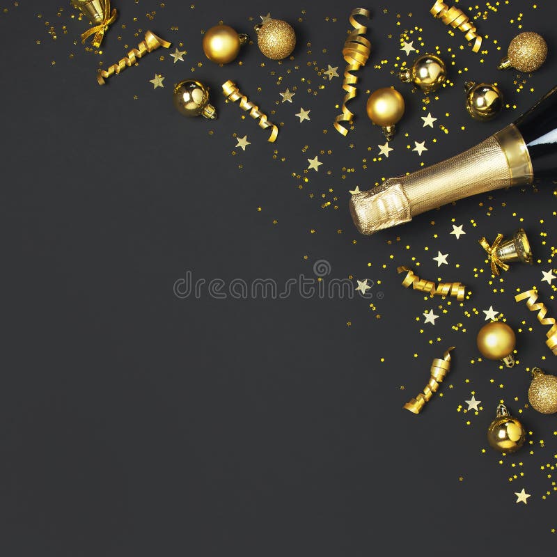 Christmas and New Year background. Champagne bottle, golden christmas balls, festive ribbons, star confetti on black. Background top view. Flat lay holiday card royalty free stock photos Christmas and New Year background. Champagne bottle, golden christmas balls, festive ribbons, star confetti on black. Background top view. Flat lay holiday card royalty free stock photos