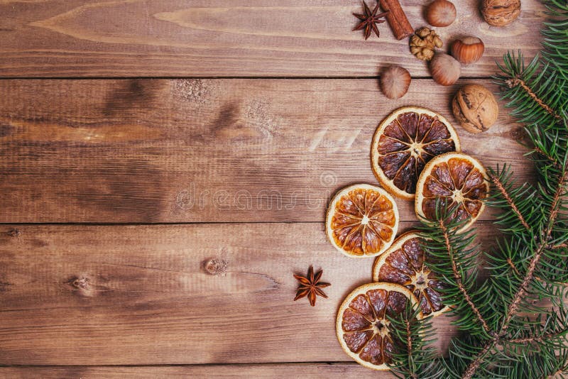 Christmas or New Year brown wooden background, Christmas food decor with fir tree.Xmas decorations, space for a text. Celebration, concept.