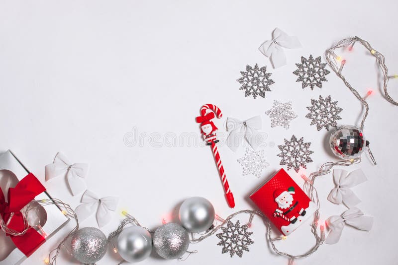 Christmas, New year composition of red and silver decorations, gift box with ribbon bow, balls and snowflakes, flatlay