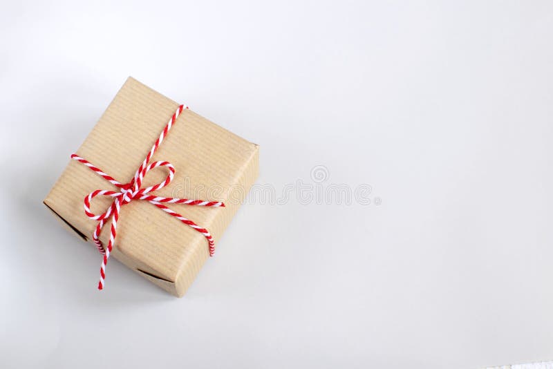Christmas or New Year concept - present box in craft paper stock images