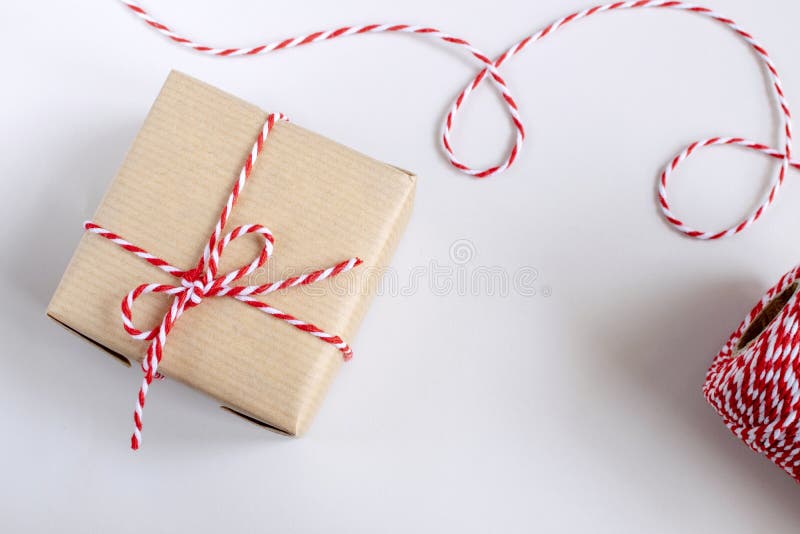 Christmas or New Year concept - present box in craft paper royalty free stock photography