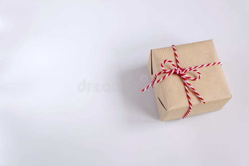 Christmas or New Year concept - present box in craft paper stock image