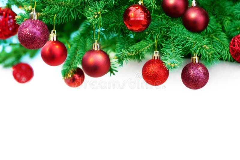 Christmas or New Year festive border, winter holidays decorative frame, red shiny balls decorations hanging on green pine branches royalty free stock photography Christmas or New Year festive border, winter holidays decorative frame, red shiny balls decorations hanging on green pine branches royalty free stock photography