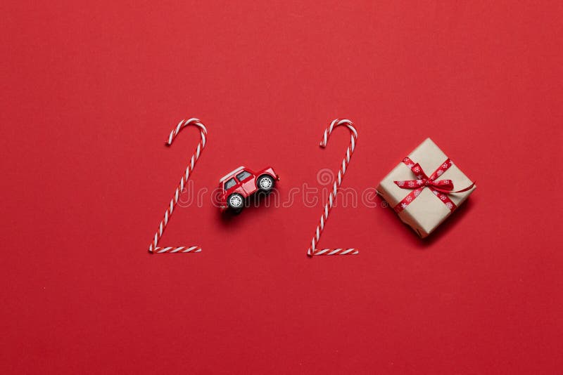 Christmas and New Year holiday composition 2020 lettering of various decoration red car toy, gift box stock photography Christmas and New Year holiday composition 2020 lettering of various decoration red car toy, gift box stock photography