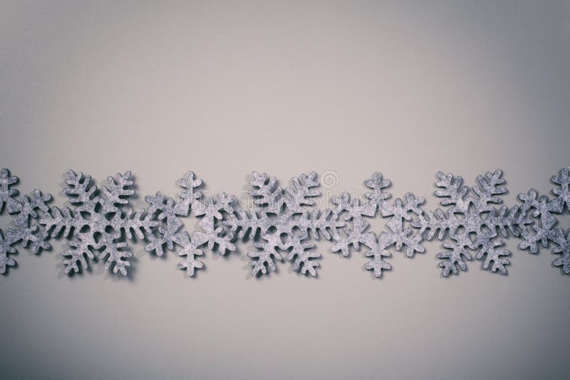 Christmas and New Years snowflake background with modern, vintage instagram filter.