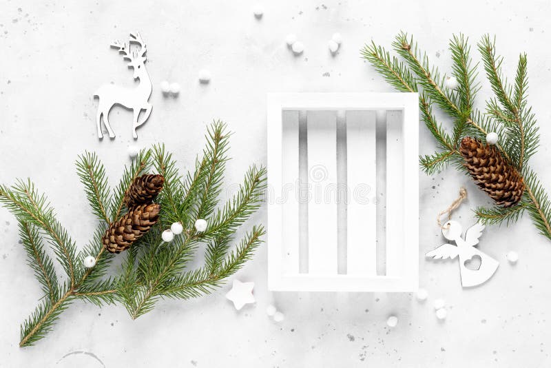 Christmas, Noel or New Year flat lay background with white crate box, fir tree and xmas decorations