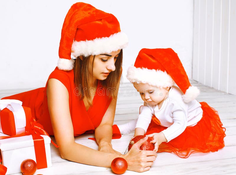 Christmas and people concept - mother and baby with gifts royalty free stock images Christmas and people concept - mother and baby with gifts royalty free stock images