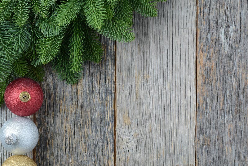 Christmas Pine Needle and Ornaments on a Rustic Wood royalty free stock photo Christmas Pine Needle and Ornaments on a Rustic Wood royalty free stock photo