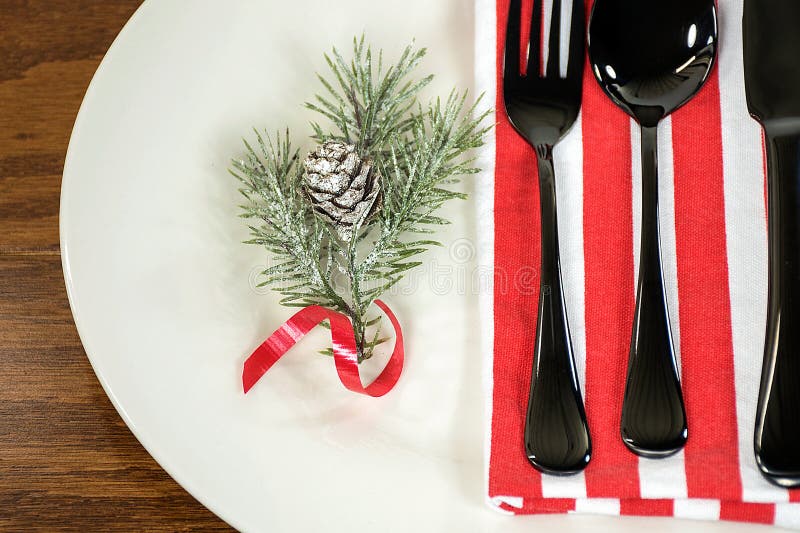 Christmas pine sprig on dinner plate