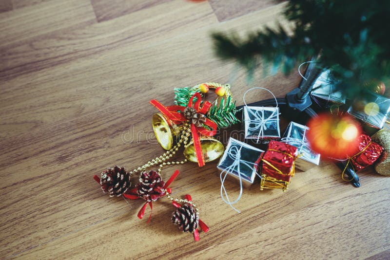 Christmas present under Christmas tree on wood floor backgrounds