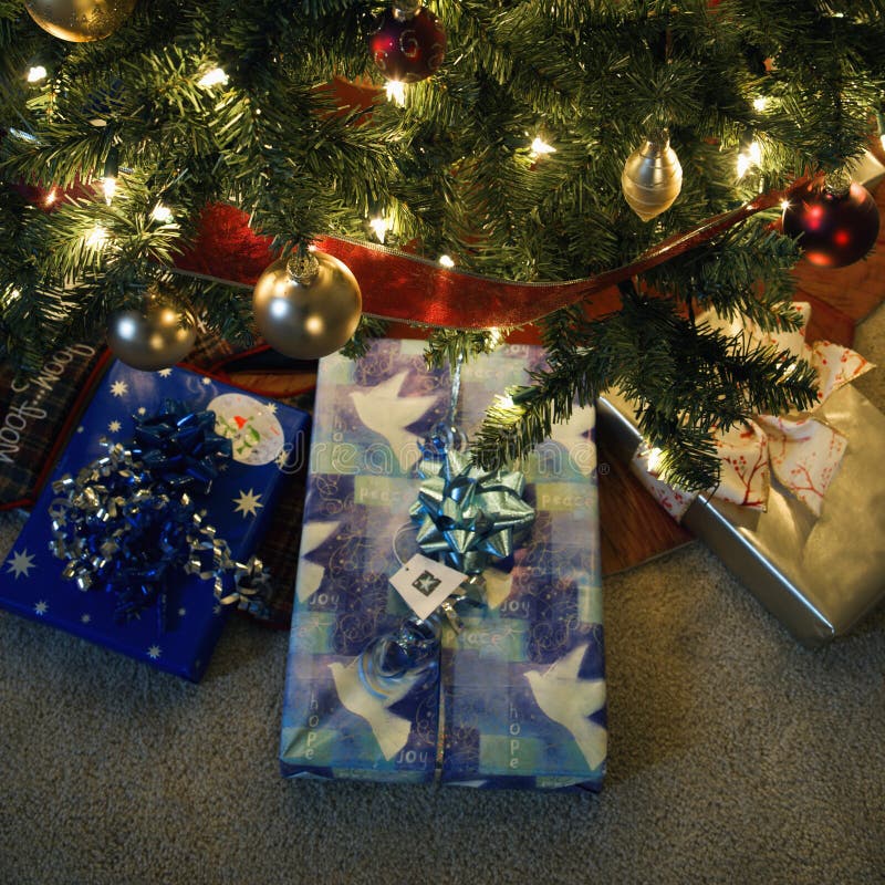 Christmas presents under tree.