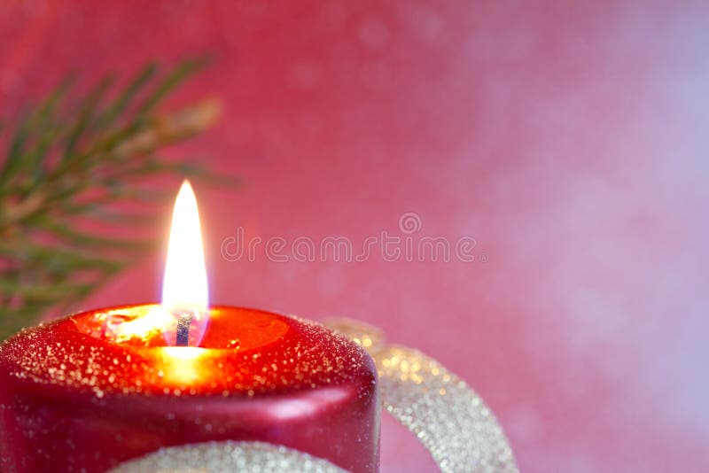 Christmas red candle closeup background