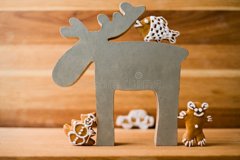 Christmas reindeer with gingerbread decoration - fish, tree aka snowman and bear royalty free stock photos