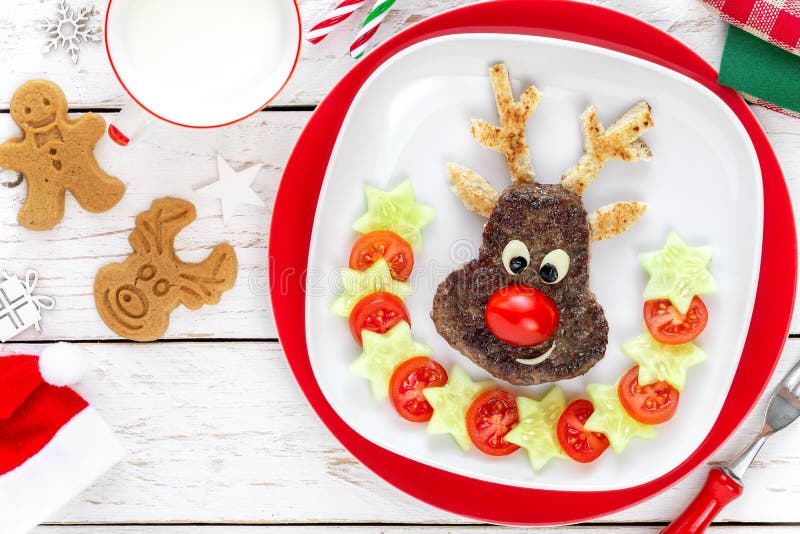 Christmas reindeer shaped burger with tomatoes and cucumbers for kids