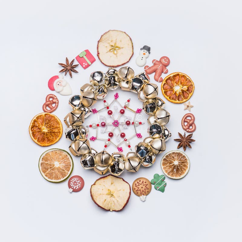 Christmas round circle frame or wreath made with dried fruits and anise stars and marzipan Christmas decor