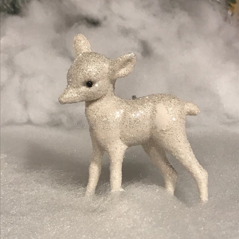 Christmas Scene with Glitter Lamb Statue and Fake Snow Stock Image