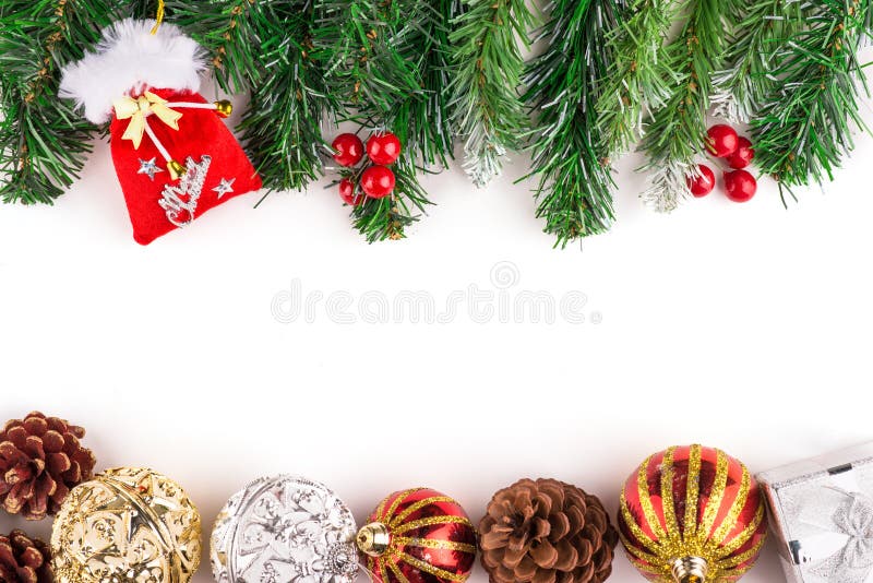 Christmas seasonal border of holly, ivy, mistletoe, cedar leaf sprigs with pine cones and gold baubles stock photo Christmas seasonal border of holly, ivy, mistletoe, cedar leaf sprigs with pine cones and gold baubles stock photo