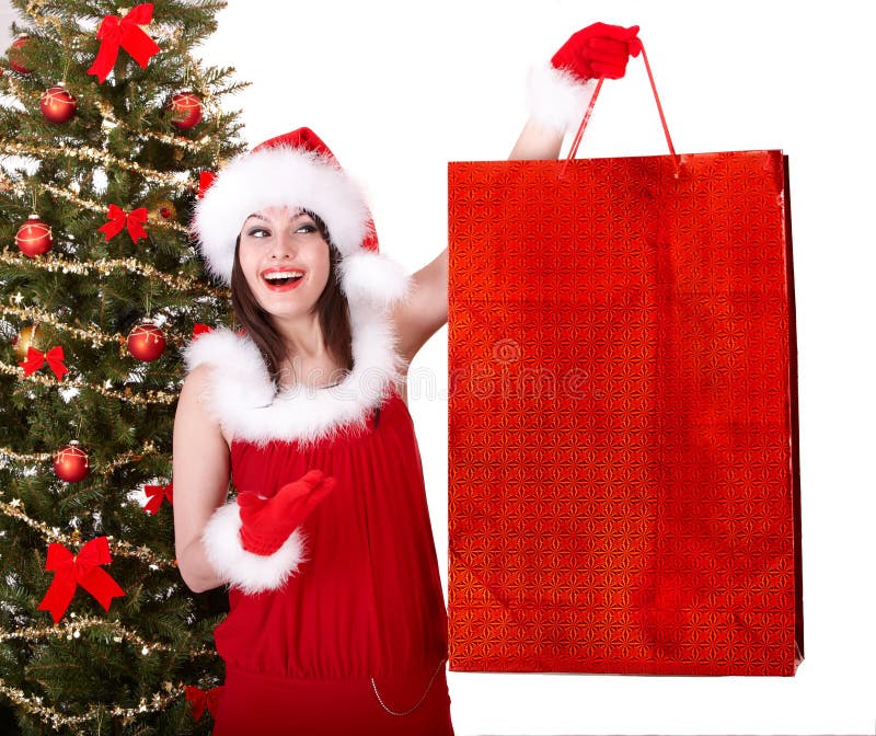 Christmas shopping of girl in santa hat, fir tree. royalty free stock photography Christmas shopping of girl in santa hat, fir tree. royalty free stock photography