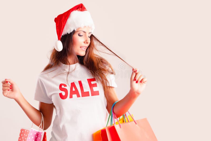 Christmas shopping woman with shopping bags  on white stock photography