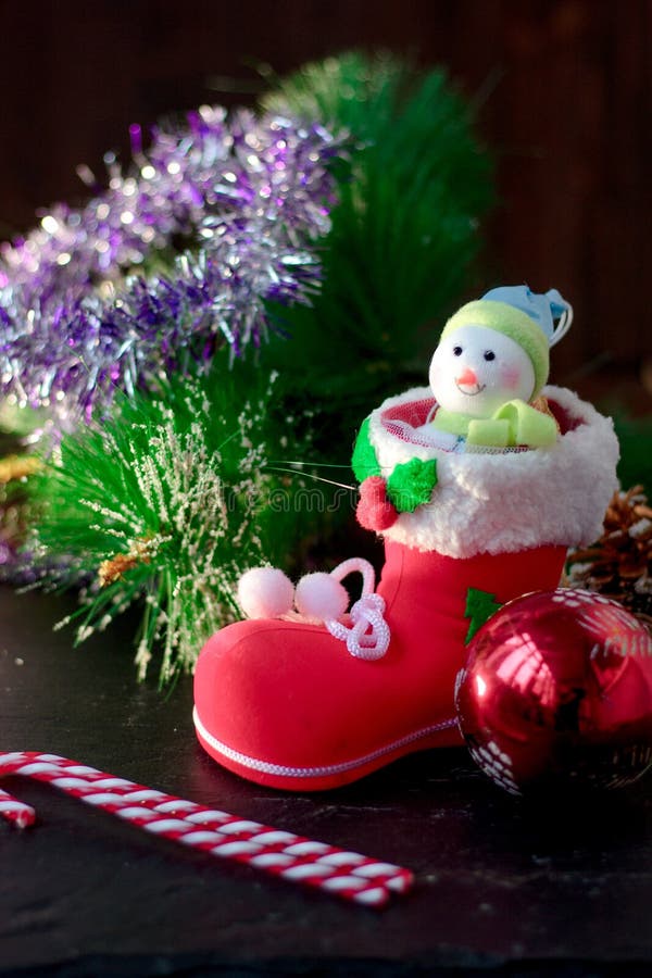 Christmas snowman sitting inside red christmas boot. stock images