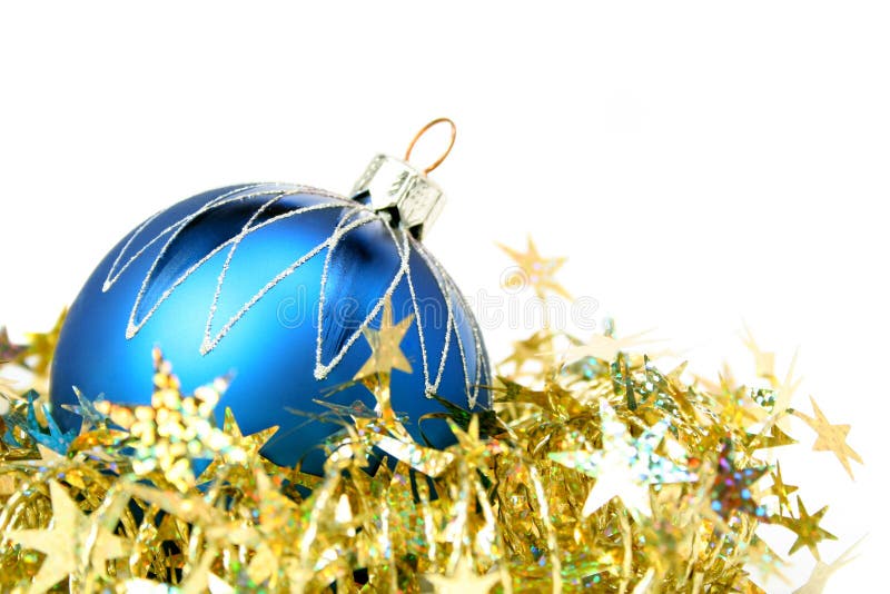 Christmas sphere of dark blue color and tinsel