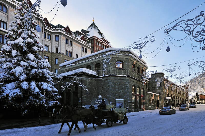 Christmas scenery in front of Badrutts Palace Hotel in Via Serlas street in St. Moritz - Switzerland. Christmas scenery in front of Badrutts Palace Hotel in Via Serlas street in St. Moritz - Switzerland