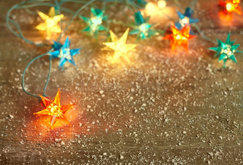 Christmas Star Lights Frame on Wooden Background with Copy Space Stock