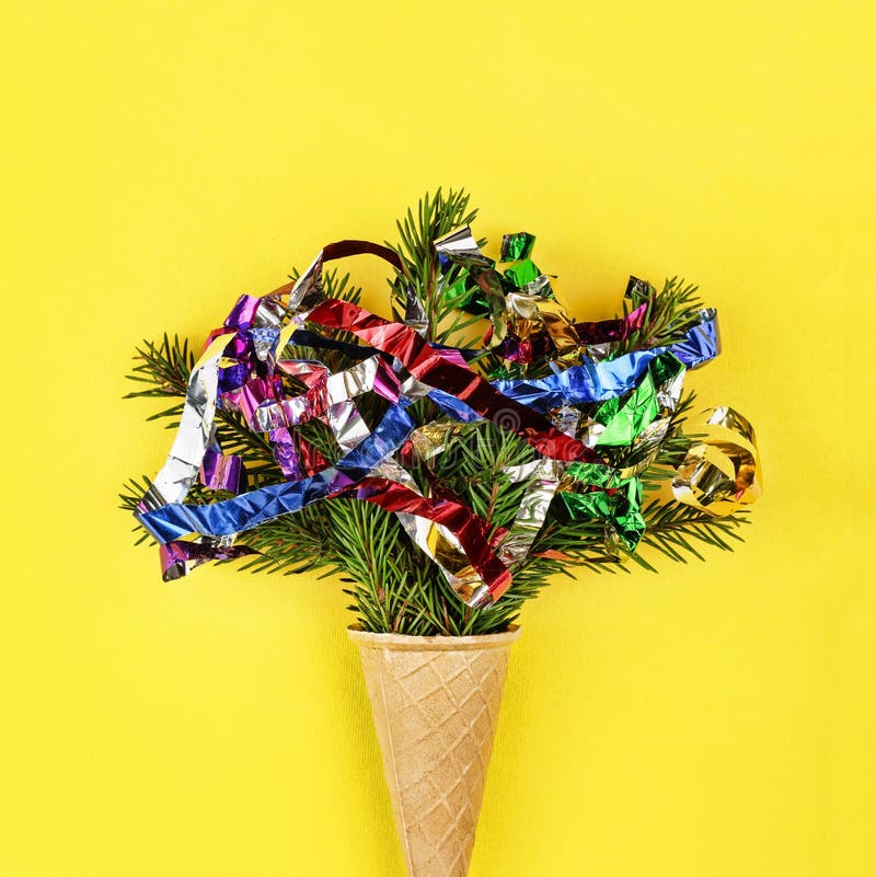 Christmas. New Year. Style minimalism. Christmas tree in ice cream cone on a yellow background. royalty free stock photos Christmas. New Year. Style minimalism. Christmas tree in ice cream cone on a yellow background. royalty free stock photos