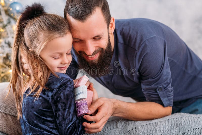 Christmas surprise family girl happy gifts daddy royalty free stock images Christmas surprise family girl happy gifts daddy royalty free stock images