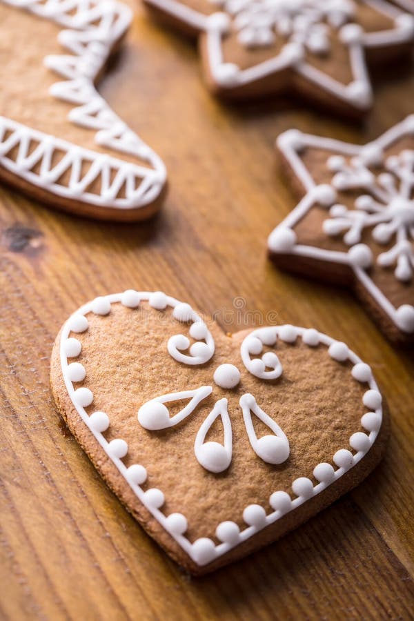 Christmas sweet cakes. Christmas homemade gingerbread cookies on wooden table. Background, dessert.